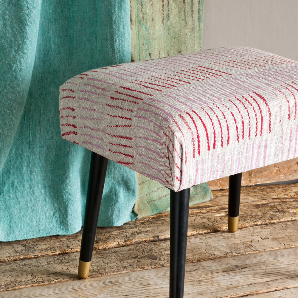 Painting your footstool’s upholstery is a fun way to give it a fresh