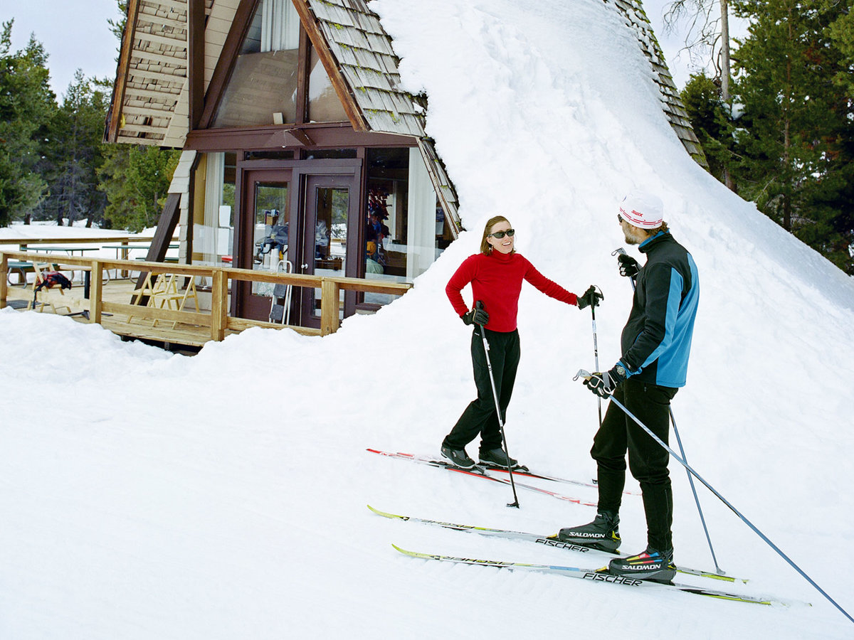 Skiers stand near a warming hut at Bear Valley's cross-country resort.