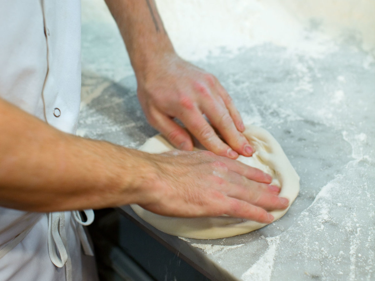 Forming pizza dough