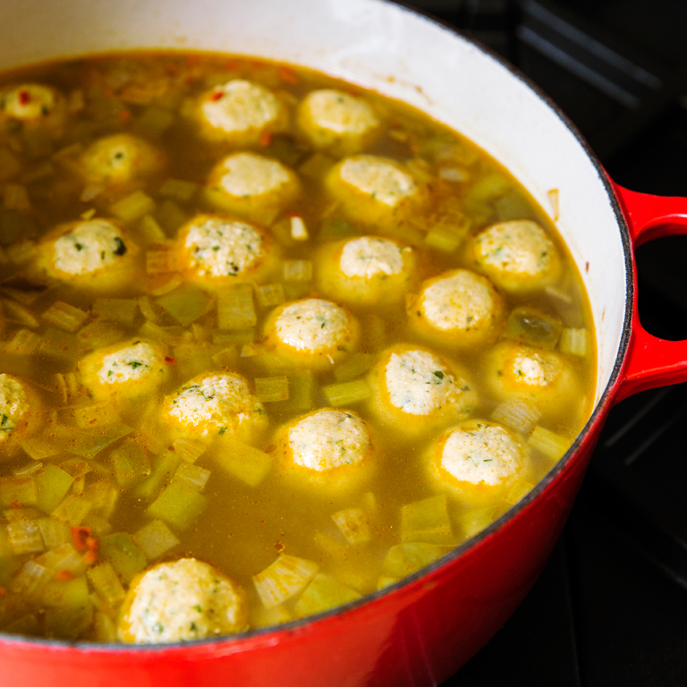 su-Spicy Matzo-Ball Soup with Trinity Vegetables and Hot Peppers Image