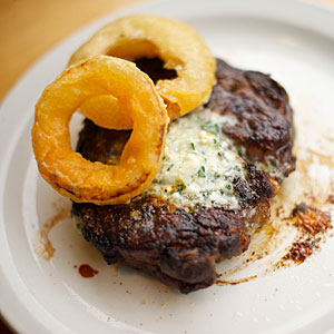 steak-laurelhurst-market-cold-smoked-ribeye-with-blue-cheese-butter-and-sweet-onion-rings