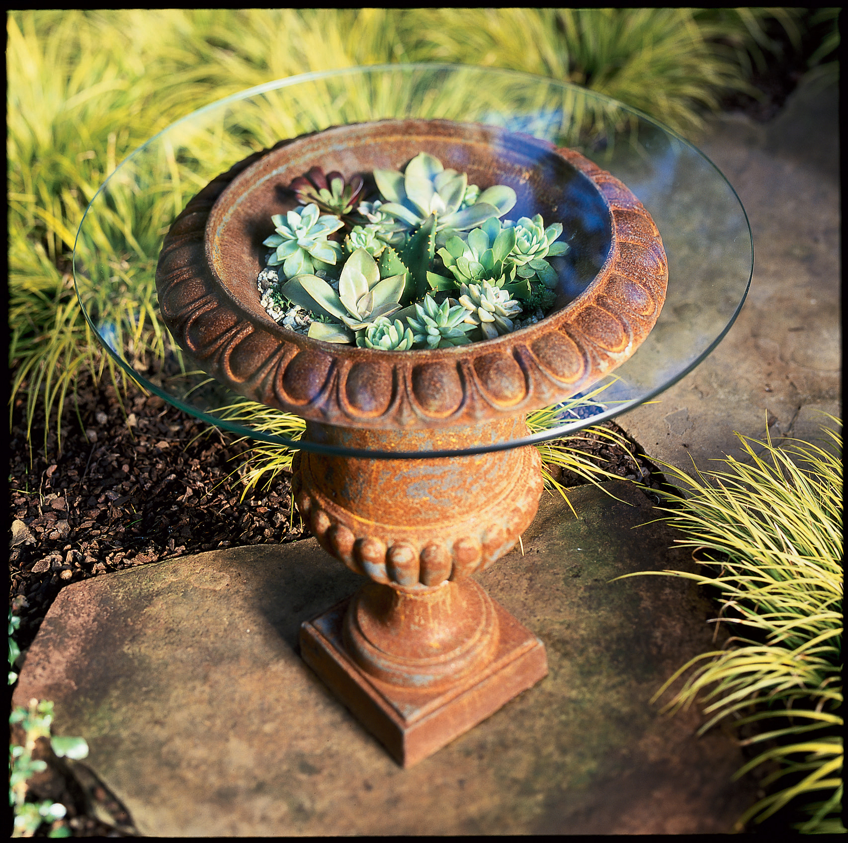 Urn as patio table – or container for a living bouquet