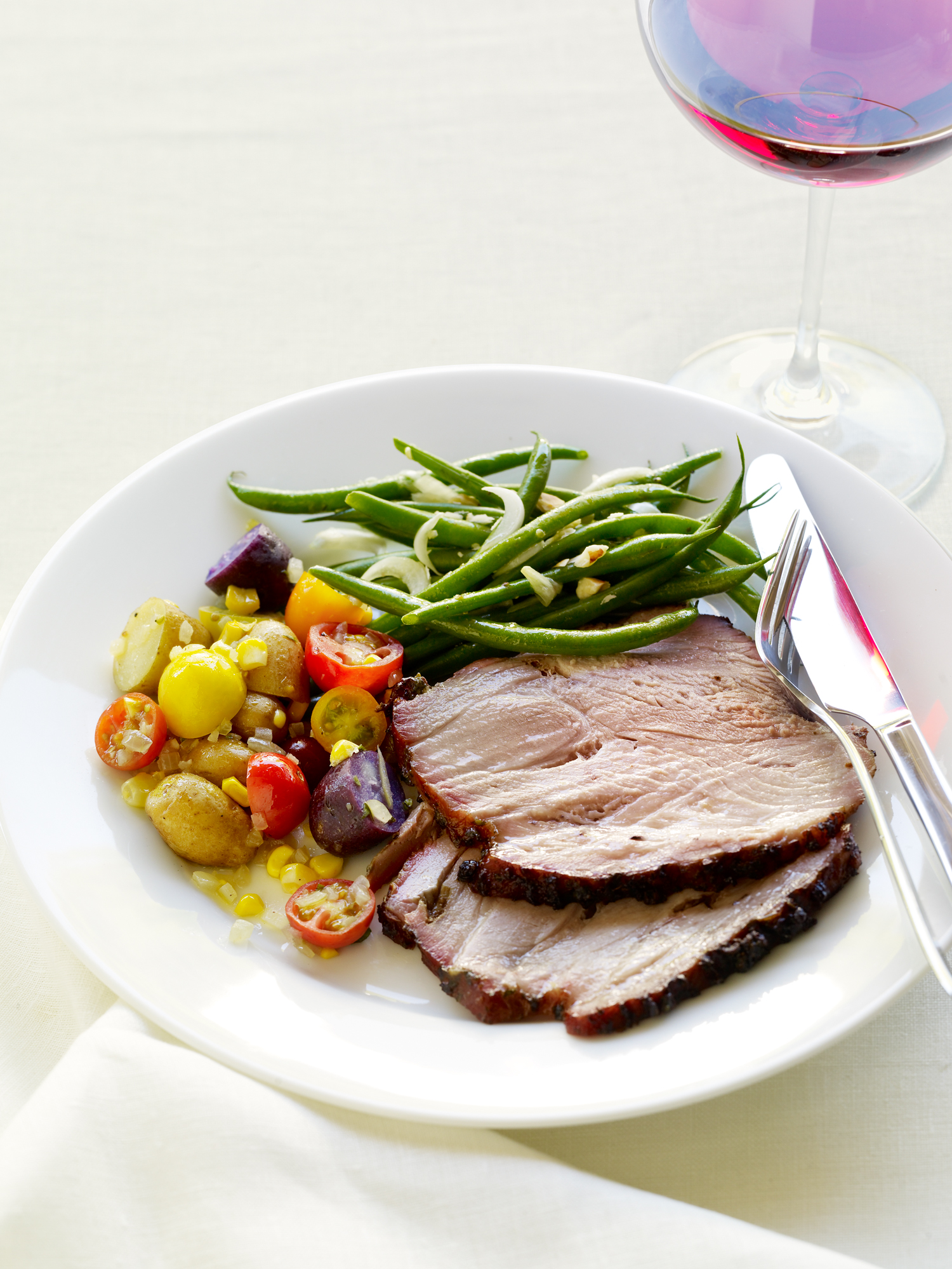 charcoal-grilled-pork-shoulder-with-fresh-herbs-and-roasted-garlic