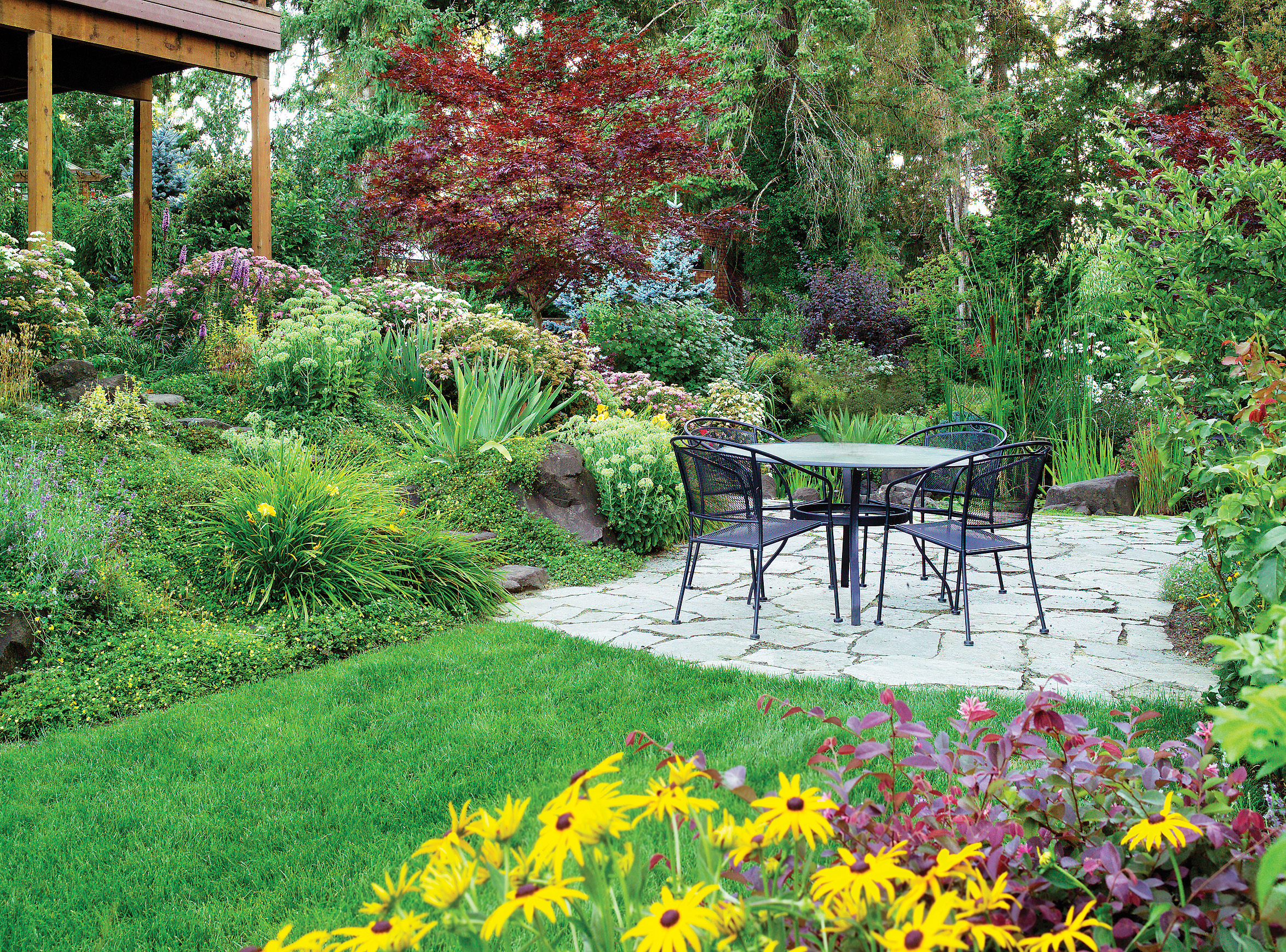 Terraces and plants make the most of a downhill garden. Here are 4