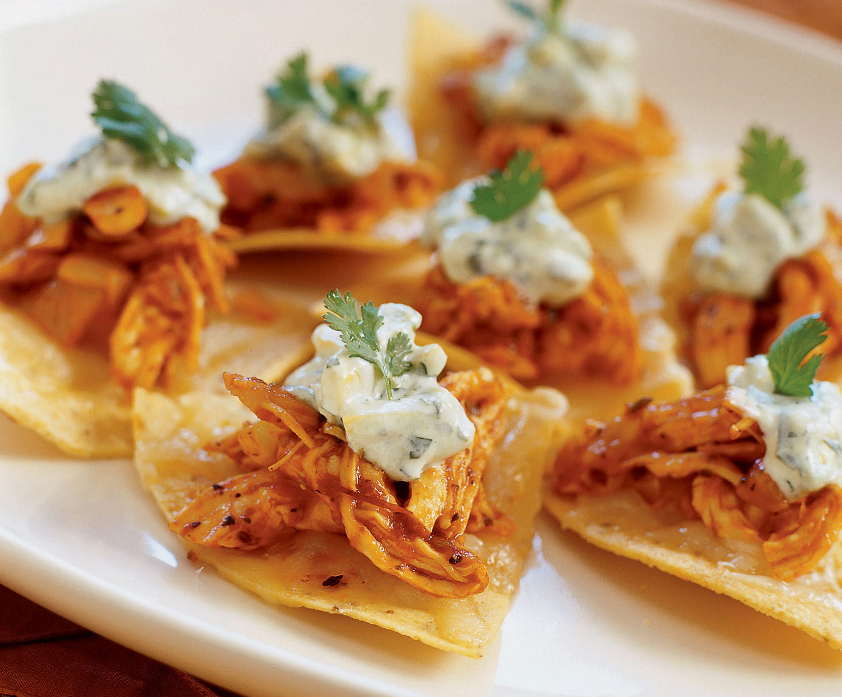 roast-chicken-chipotle-nachos-with-cilantro-avocado-crema