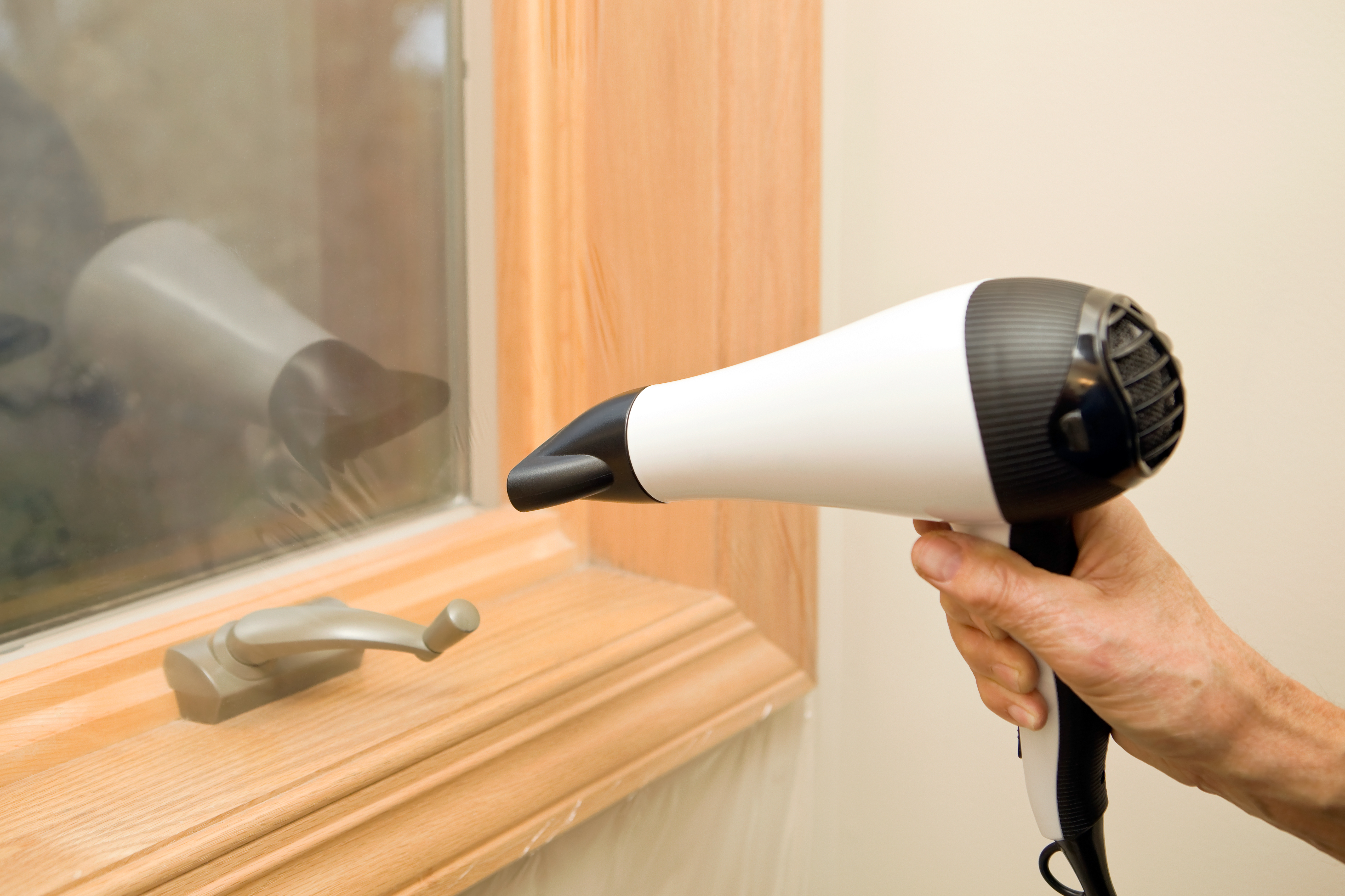 Sealing Windows with Plastic