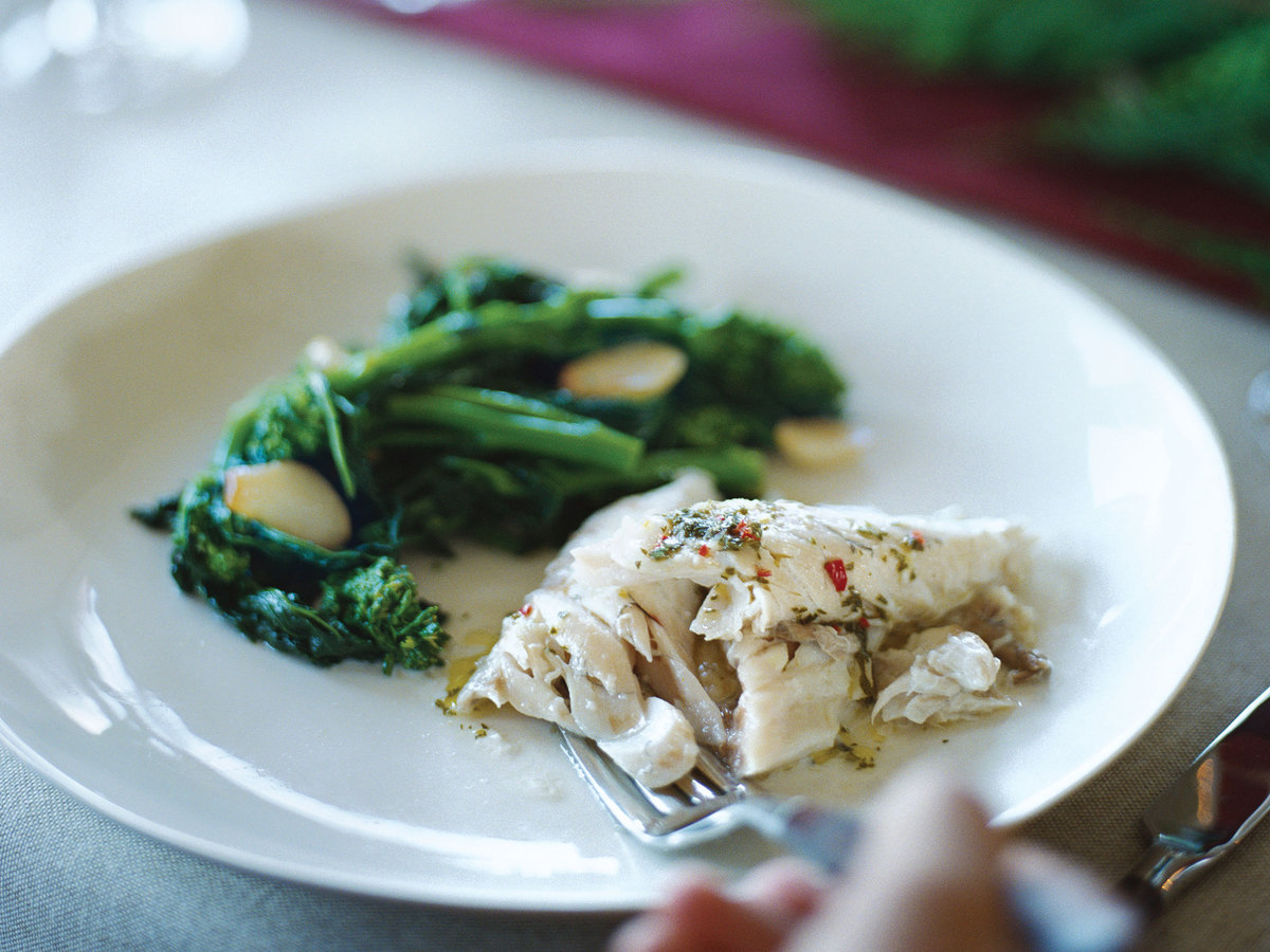 Sauted broccoli rabe with garlic and chiles; salt-baked striped bass with herb