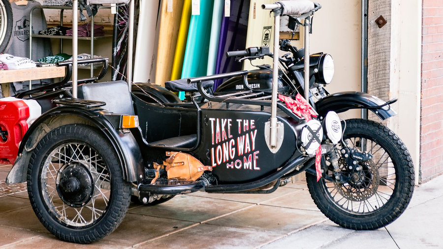 Surfboards and motorcycles at Iron & Resin Shop in Ventura, California