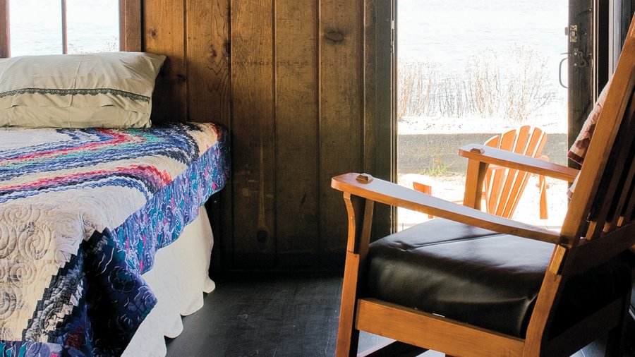 Cozy cabins at Cama Beach State park in Washington inside the room with door open to see view of ocean