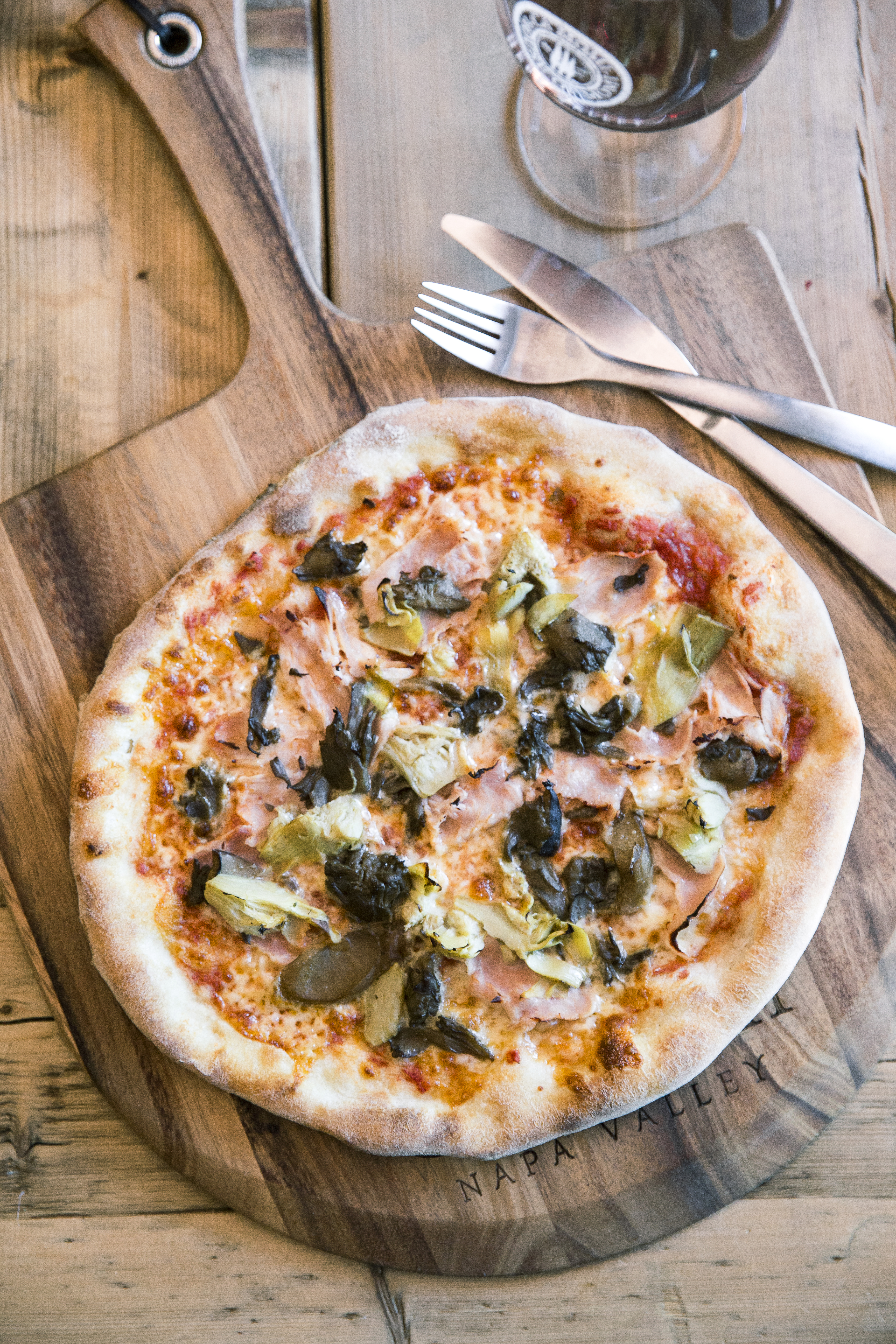 capricciosa-pizza-ham-mushrooms-mozzarella-and-artichokes