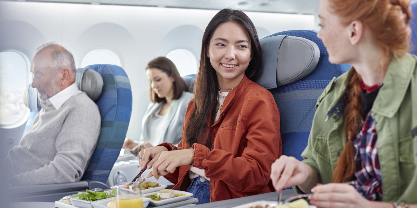 Airplane Passengers Eating